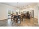Eat-in kitchen featuring stainless steel appliances, wood floors, and adjacent access to outdoor patio at 2014 Drawbridge Dr, Fort Mill, SC 29707