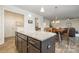 Open concept kitchen with eat-in island and views of the living room and dining room at 2014 Drawbridge Dr, Fort Mill, SC 29707