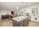 Open concept kitchen with eat-in island and views of the living room and dining room at 2014 Drawbridge Dr, Fort Mill, SC 29707