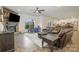 Spacious living room featuring a stone fireplace, large windows, and a comfortable leather sofa at 2014 Drawbridge Dr, Fort Mill, SC 29707