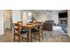 Open living room and dining space featuring wood floors and lots of natural light at 2014 Drawbridge Dr, Fort Mill, SC 29707
