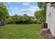 Lush green backyard with ample space for recreation and relaxation at 207 Eden St, Davidson, NC 28036