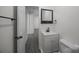 Bathroom with a sink and vanity offering modern finishes and a view to the hallway at 207 Eden St, Davidson, NC 28036
