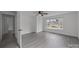 Bright bedroom with a ceiling fan and a large window, with ample space and neutral colors at 207 Eden St, Davidson, NC 28036