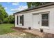 Well-kept home featuring a brick facade, manicured lawn, and cozy front entrance at 207 Eden St, Davidson, NC 28036