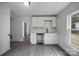Bright kitchen featuring stainless steel appliances, white cabinetry, and a view from the window at 207 Eden St, Davidson, NC 28036