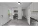 Bright kitchen with modern stainless steel appliances and white cabinetry, perfect for cooking and entertaining at 207 Eden St, Davidson, NC 28036