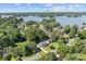 Aerial shot of a beautiful neighborhood near the lake with green trees and a blue sky at 20840 Sierra Vista Dr, Cornelius, NC 28031