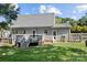 Exterior of home featuring a spacious backyard with deck and mature trees at 20840 Sierra Vista Dr, Cornelius, NC 28031