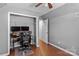 Bedroom space with hardwood floors and a desk featuring dual monitors at 20840 Sierra Vista Dr, Cornelius, NC 28031