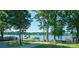 Scenic lake view surrounded by mature trees at 20840 Sierra Vista Dr, Cornelius, NC 28031