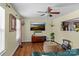 Bright living room with a modern ceiling fan and a view of the kitchen from a pass through at 20840 Sierra Vista Dr, Cornelius, NC 28031