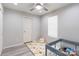 Bright bedroom with a ceiling fan at 211 E Mcneely Ave, Mooresville, NC 28115