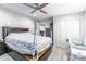 Bright bedroom featuring a ceiling fan and closet at 211 E Mcneely Ave, Mooresville, NC 28115