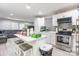 Open-concept kitchen with white cabinets, stainless appliances, and a center island perfect for entertaining at 211 E Mcneely Ave, Mooresville, NC 28115