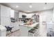 Modern kitchen with white cabinetry, stainless steel appliances, and center island with seating at 211 E Mcneely Ave, Mooresville, NC 28115