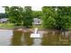 Aerial view of this home featuring a private dock and waterfront access at 235 Pebble Point Rd, Salisbury, NC 28146
