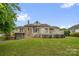 Charming backyard featuring a spacious deck, balconies and a well-maintained lawn, ideal for outdoor enjoyment at 235 Pebble Point Rd, Salisbury, NC 28146