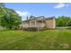 Inviting backyard with a large deck, lush lawn, and a gazebo, perfect for outdoor gatherings and relaxation at 235 Pebble Point Rd, Salisbury, NC 28146