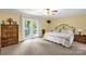 Bright bedroom with a ceiling fan and access to the balcony at 235 Pebble Point Rd, Salisbury, NC 28146