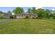 Charming brick home with a well-manicured lawn and mature trees, offering great curb appeal at 235 Pebble Point Rd, Salisbury, NC 28146