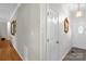 Bright hallway with neutral colors and an ornate mirror at 235 Pebble Point Rd, Salisbury, NC 28146