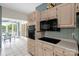 Charming kitchen with stainless steel appliances and an adjacent breakfast nook with water views at 235 Pebble Point Rd, Salisbury, NC 28146
