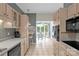Cozy kitchen with stainless steel appliances, tiled floor, and a view of the breakfast nook at 235 Pebble Point Rd, Salisbury, NC 28146