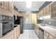 Charming kitchen featuring ample cabinetry, tiled floors, and modern appliances at 235 Pebble Point Rd, Salisbury, NC 28146