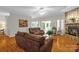 Inviting living room with stone fireplace, ceiling fan, and hardwood floors at 235 Pebble Point Rd, Salisbury, NC 28146