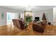 Spacious living room with stone fireplace, comfortable seating, and hardwood floors at 235 Pebble Point Rd, Salisbury, NC 28146