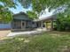 Backyard featuring a patio, carport, and lush landscaping at 2500 Cedar Cove Dr, Harrisburg, NC 28075
