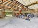 Large barn interior with an open layout perfect for storage, hobbies, or a workshop at 2500 Cedar Cove Dr, Harrisburg, NC 28075