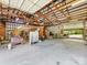 Spacious barn interior with high ceilings, wooden beams, and ample room for storage or projects at 2500 Cedar Cove Dr, Harrisburg, NC 28075