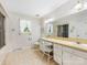 Light and airy bathroom with double sinks, vanity, and a shower with sliding glass doors at 2500 Cedar Cove Dr, Harrisburg, NC 28075