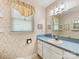 Bathroom featuring vintage wallpaper, window and single sink with vanity at 2500 Cedar Cove Dr, Harrisburg, NC 28075