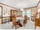 Traditional dining room with a large table, wood accents, and natural light at 2500 Cedar Cove Dr, Harrisburg, NC 28075