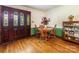 Cozy dining room featuring hardwood floors, a wooden table set, and charming decor at 2500 Cedar Cove Dr, Harrisburg, NC 28075
