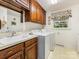 Functional laundry room with a sink, cabinets, and modern washer and dryer at 2500 Cedar Cove Dr, Harrisburg, NC 28075