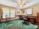 Home office with natural light, a ceiling fan, and ample storage space at 2500 Cedar Cove Dr, Harrisburg, NC 28075