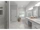 A bright bathroom features double sinks, ample counter space, and a soaking tub for ultimate relaxation at 328 Whippoorwill Rd, Mooresville, NC 28117