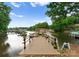 Charming covered dock with a scenic waterfront view, perfect for relaxing and enjoying water activities at 328 Whippoorwill Rd, Mooresville, NC 28117