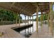 Covered dock with wood beams, offering a great spot for waterside relaxation and enjoyment at 328 Whippoorwill Rd, Mooresville, NC 28117