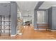 Inviting foyer with hardwood floors, staircase, and an open view to the living spaces at 328 Whippoorwill Rd, Mooresville, NC 28117