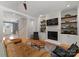 Cozy living room with fireplace, built-in shelves, hardwood floors, and comfortable seating at 328 Whippoorwill Rd, Mooresville, NC 28117