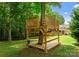 Treehouse built around a mature tree, with railings, ladder and pulley features at 328 Whippoorwill Rd, Mooresville, NC 28117