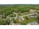 Scenic aerial view of a quiet neighborhood surrounded by lush greenery and mature trees at 335 Wintergreen Ct, Kings Mountain, NC 28086