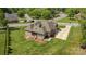 Aerial view of a home with a large yard, screened in porch and three car garage in a neighborhood at 335 Wintergreen Ct, Kings Mountain, NC 28086