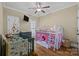 Bright ' bedroom with hardwood floors, playful decor, and bunk bed with playhouse feature at 335 Wintergreen Ct, Kings Mountain, NC 28086