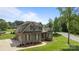 Charming two-story brick home with a well-manicured lawn and a paved driveway at 335 Wintergreen Ct, Kings Mountain, NC 28086